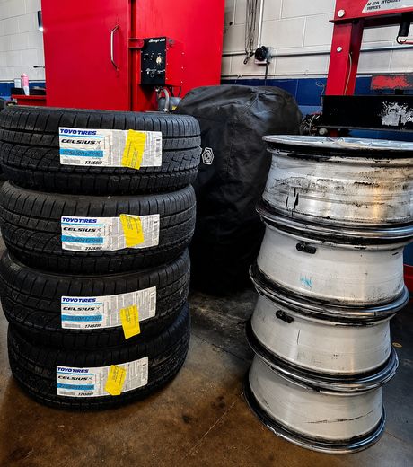 A set of new tires and the wheels they are going onto at DAVID's Auto Care